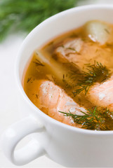 Salmon soup in a saucepan.