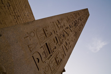 A red granite obelisk in front of the Luxor Temple, Egypt