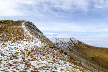 Pen y Fan and Corn Du are the highest mountains in the Brecon Beacons National Park. Panoramic format with winter snow. - obrazy, fototapety, plakaty