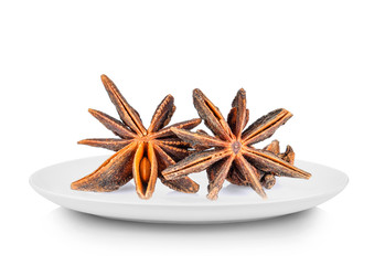 anise in white plate on white background