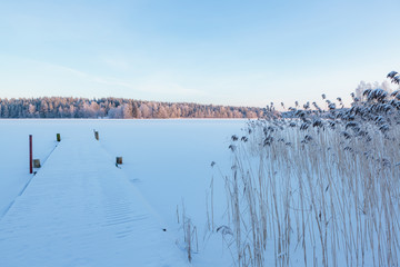 Winter lake scenery in finland at evening