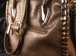 seams on leather hand bag