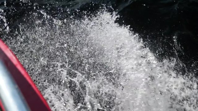 The wake behind a boat as it travels through water
