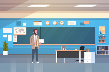 School Classroom Interior With Male Teacher Standing Over Chalk Board In Class Room Flat Vector Illustration