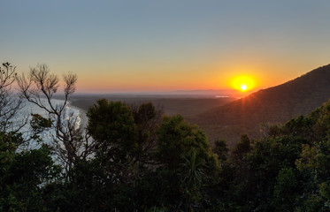 sunset behind the mountain