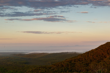 Mist moving long the ridgeline at dawn