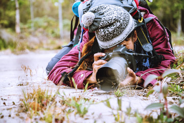 Photographer asian women Traveling photograph Nature. travel relax in the holiday walk in the forest. travel relax in the holiday.  Thailand