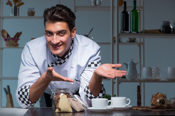 Coffee barista working late in shop preparing drinks