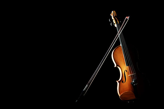 Violin isolated on black with bow