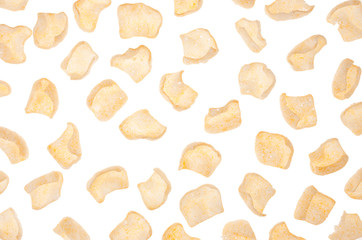 Spicy chips flakes isolated on white background, pattern, top view.