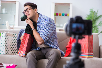 Male fashion blogger recording video for vlog