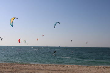 Kite surfing on a beach in Dubai.