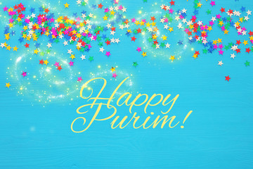 Purim celebration concept (jewish carnival holiday) with confetty. Top view.