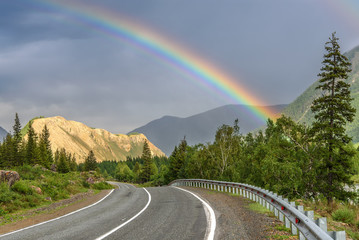 road mountain rainbow forest cloudy