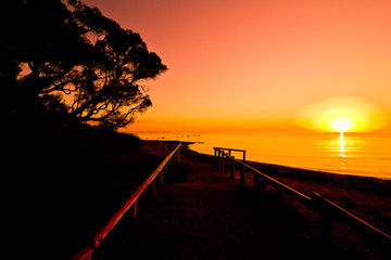 orange sunrise at track leading to beach dunsborough western australia