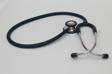 medical equipment: stethoscope, dark blue, isolated.