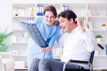 Doctor discussing x-ray image with patient