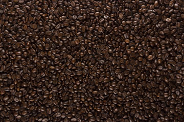 roasted coffee beans on wood texture