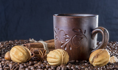 clay cup with coffee on the background of grains