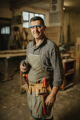 carpenter works with manual and electric equipment