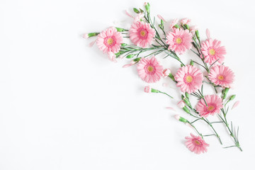 Flowers composition. Frame made of pink flowers on white background. Flat lay, top view, copy space