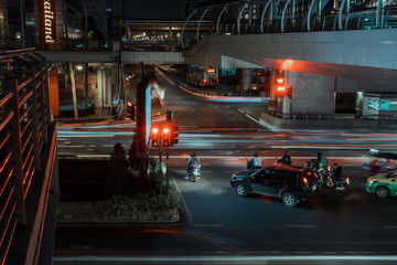 A busy street in Bangkok at night.