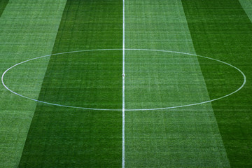 Middle of soccer field with textured background grass