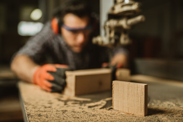 carpenter works with manual and electric equipment