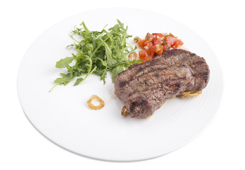 Delicious beef steak with arugula.