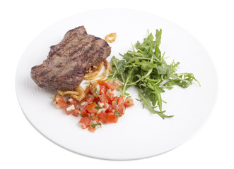 Delicious beef steak with arugula.