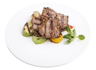 Filet mignon with vegetables.