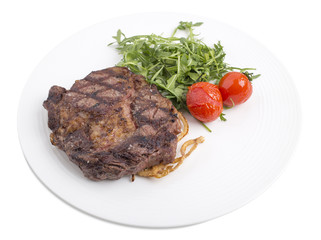 Delicious beef steak with arugula.