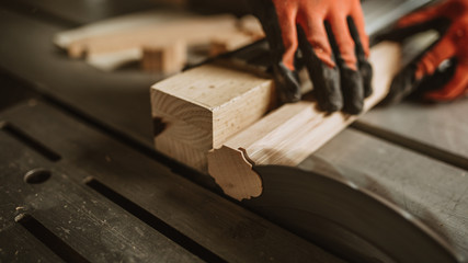 carpenter works with manual and electric equipment
