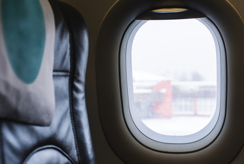 Naklejka premium Air plane widow with empty seat. Travel and journey by plane concept