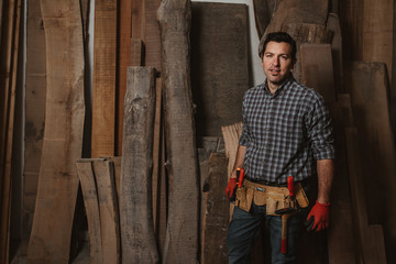 carpenter works with manual and electric equipment