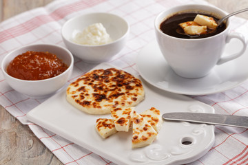 Cheese, cloudberry jam, and coffee