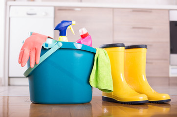 Cleaning equipment on floor in kitchen