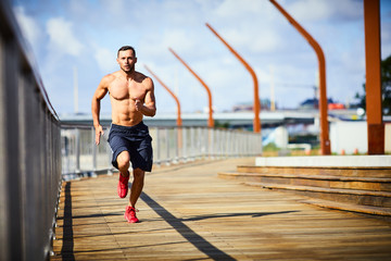 Man running fast outdoors in the city