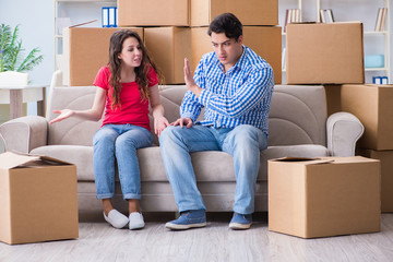 Young pair moving in to new house with boxes