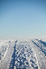 Car trails in wintry backcountry