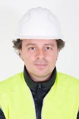 Portrait of a smiling engineer man Isolated on white