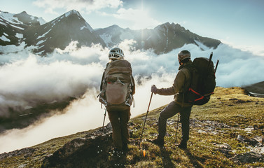 Couple travelers on mountain summit together love and Travel Lifestyle wanderlust concept adventure...