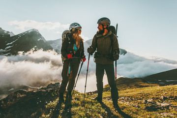 Travel Couple backpackers man and woman hiking in mountains love and adventure Lifestyle wanderlust...