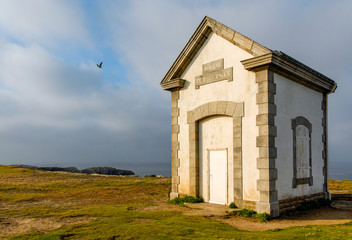 The rising sun illuminates the siren of Belle-Ile who warned the boats of the presence of the...