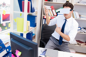 Employee watching movie on vr virtual reality glasses