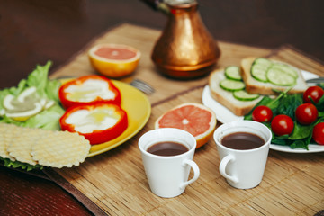 Fototapeta na wymiar natural and healthy breakfast with toast, coffee and vegetables for vegetarian