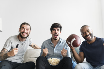 Friends cheering sport league together