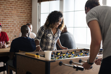 People playing table football - obrazy, fototapety, plakaty