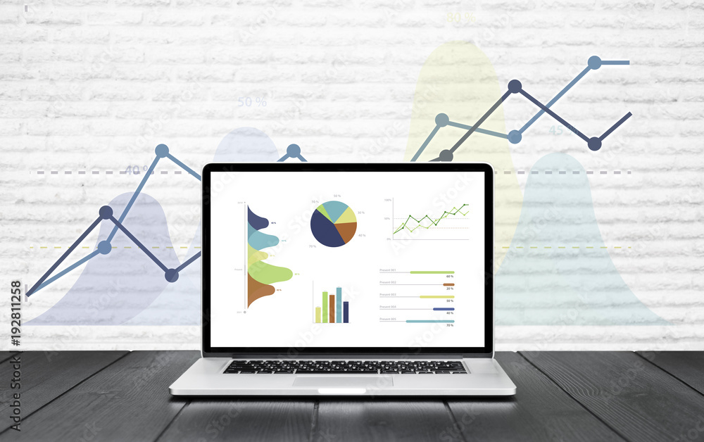 Poster laptop on wooden table showing charts and graph colorful graphics background