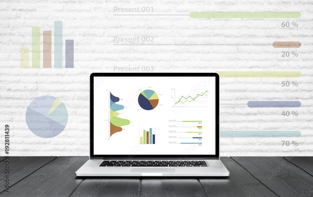 Aufkleber laptop on wooden table showing charts and graph colorful graphics background